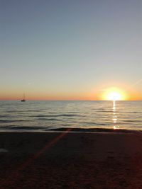 Scenic view of calm sea at sunset