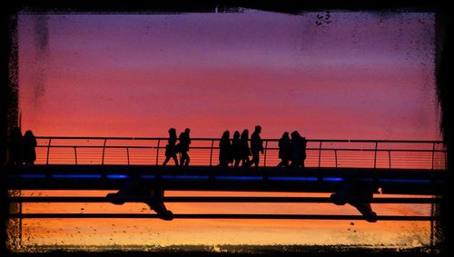 Silhouette of woman at sunset