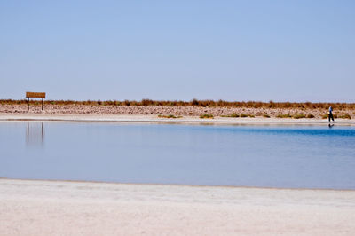 Scenic view of calm sea against clear sky