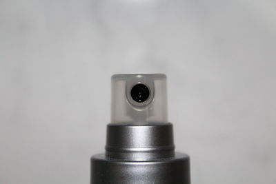 Close-up of camera over white background