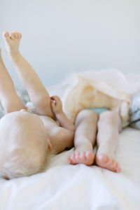 Brother and sister on bed