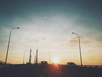 Street light against sky at sunset