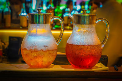 Close-up of glass jars on table