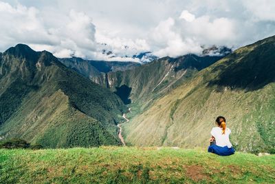 Man on mountain against sky