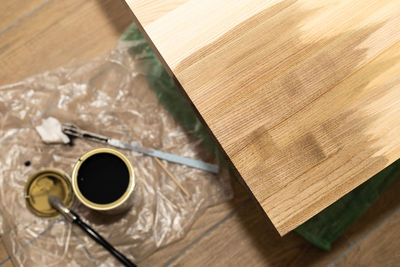 Covering with a brush colored oil of a wooden ash shield