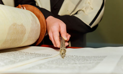 Midsection of man praying