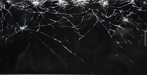 Full frame shot of wet spider web at night