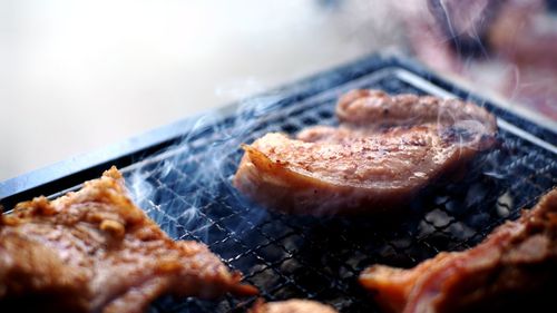 Close-up of meat on barbecue grill