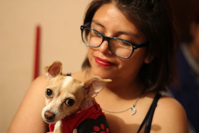 Close-up of teenage girl with dog