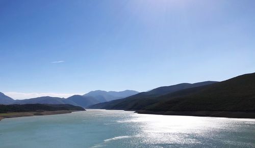 Scenic view of mountains against clear blue sky