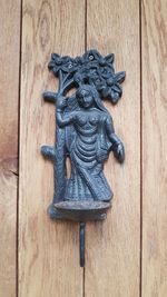 Close-up of a sculpture on wooden door