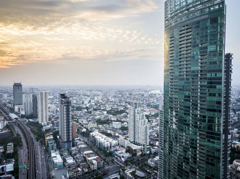 High angle view of buildings against sky during sunset