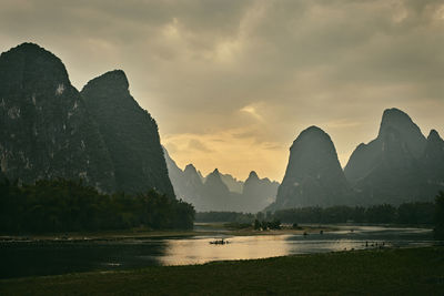 Panoramic view of river and mountains against sky