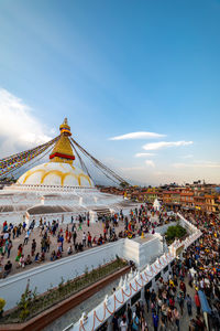 Aerial view of people in front of temple