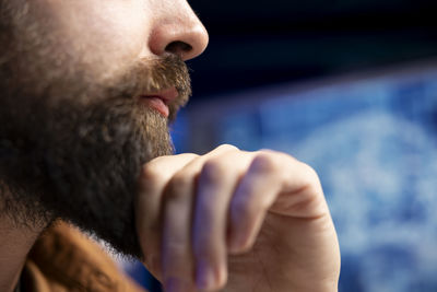 Close-up of man smoking outdoors