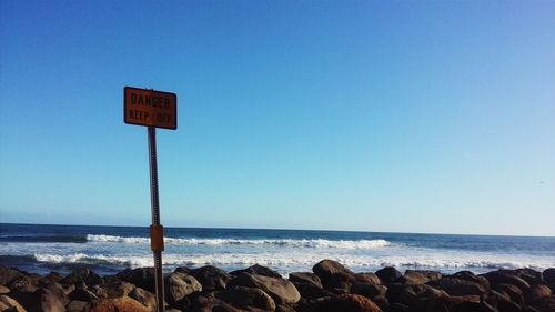 Warning sign on beach