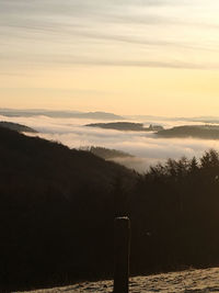 Scenic view of landscape against sky during sunset