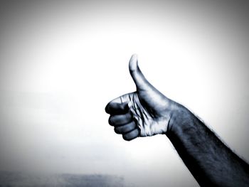 Close-up of man hand against white background