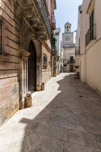 Alley amidst buildings in city