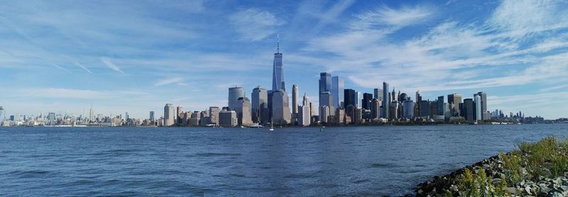 Buildings by sea in city