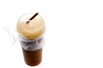 Close-up of coffee cup against white background