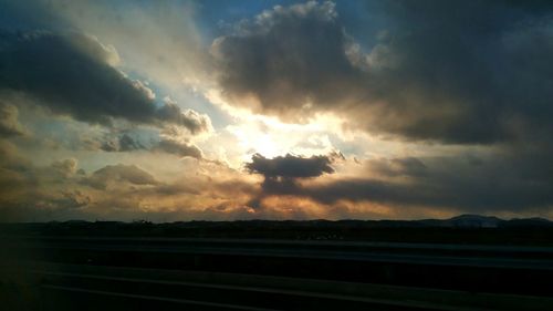 Scenic view of landscape against cloudy sky