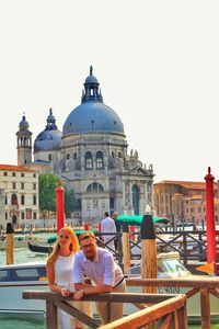 People in temple against clear sky