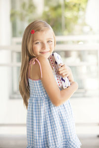 Portrait of smiling girl standing outdoors