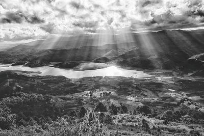 Scenic view of landscape against cloudy sky