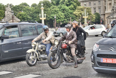 People riding bicycle on city street