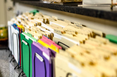 Close-up of colorful files for sale in store