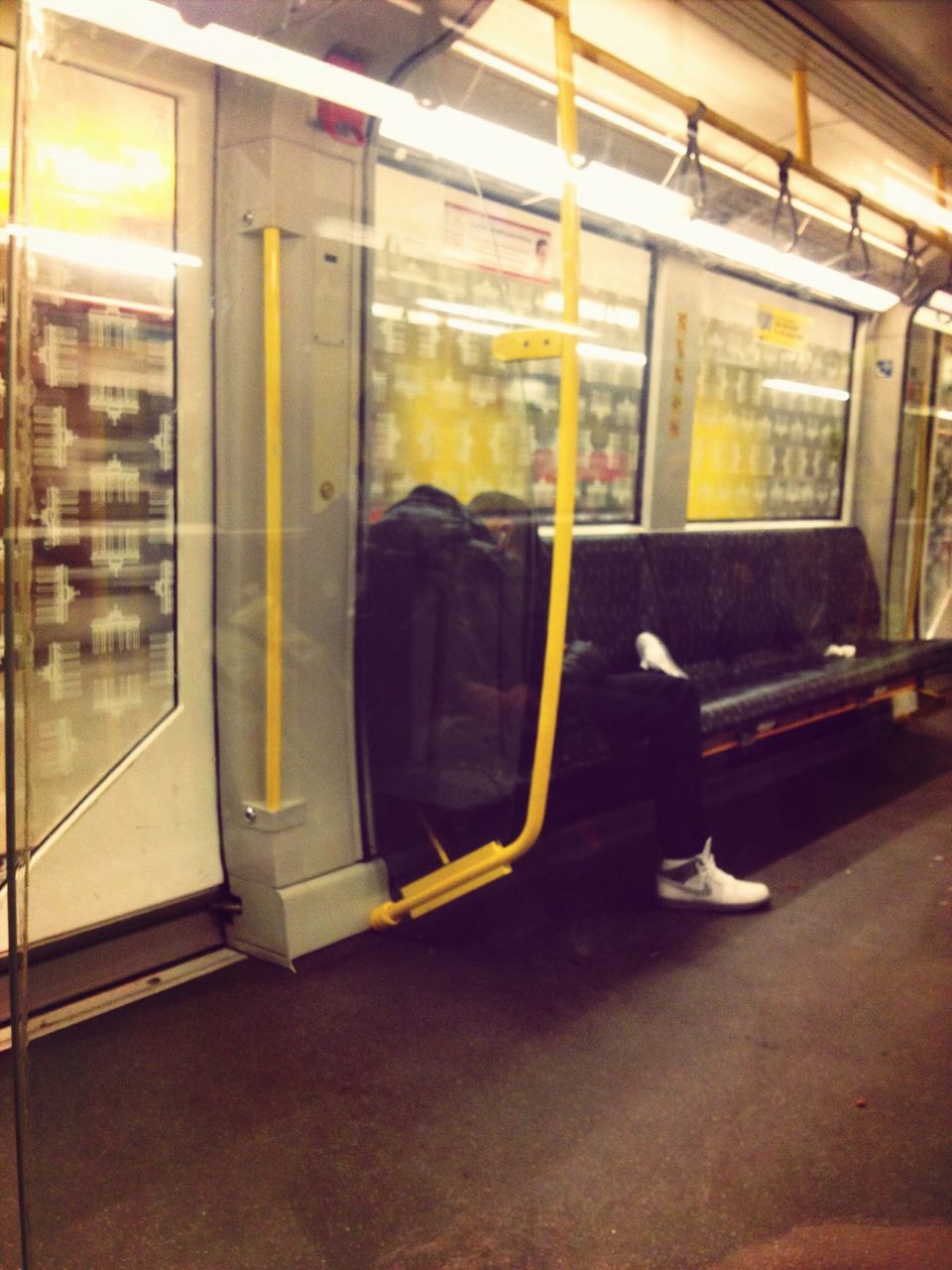 transportation, public transportation, mode of transport, train - vehicle, men, lifestyles, indoors, full length, rear view, passenger train, railroad station, window, rail transportation, travel, railroad station platform, on the move, glass - material, train