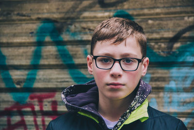 Portrait of young man in urban settingvwith graffiti