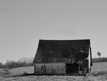 Built structure on field against clear sky