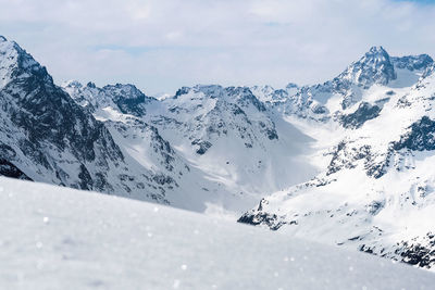 Scenic view of snowcapped mountains against sky