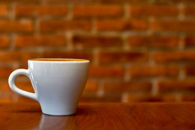 Close-up of coffee cup on table