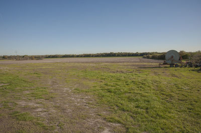 Scenic view of field against clear sky