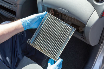 High angle view of man repairing car