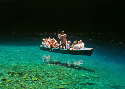 People on boat in sea