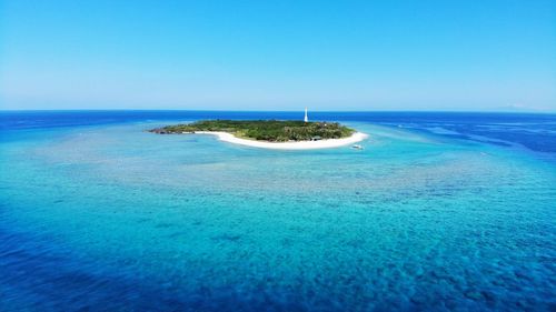 Scenic view of sea against clear blue sky