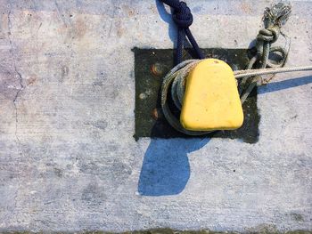 Directly above shot of mooring bollard at pier