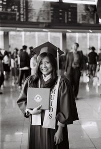 Portrait of a smiling young woman standing outdoors