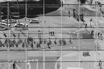 Reflection of people on glass window