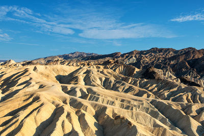 Scenic view of mountain against cloudy sky