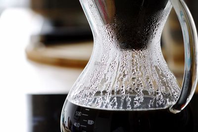 Close-up of coffee maker on table