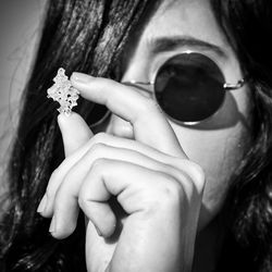 Close-up of woman holding flowers