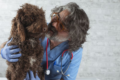 Veterinarian doctor and dog at the veterinary office. medicine, pet care, healthcare. 