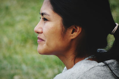 Close-up portrait of woman looking away