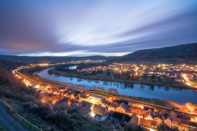 High angle view of illuminated buildings in city at night