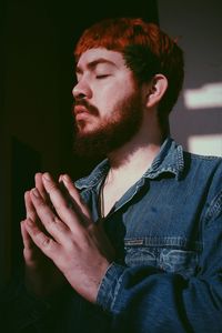 Portrait of young man looking away